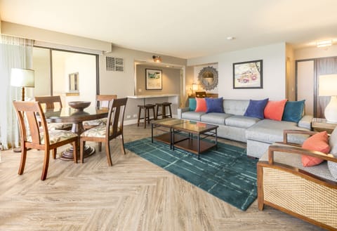 Step into your bright, open living space where colorful accents, plush seating, and a welcoming dining area create the perfect backdrop for your getaway moments together.