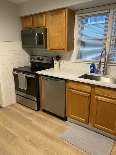 Recently remodeled kitchen with stove, oven, microwave, and dishwasher