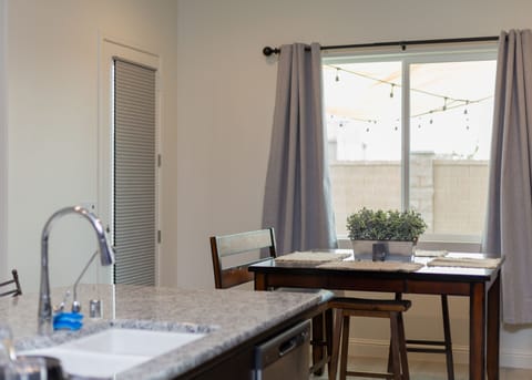 Bright dining space perfect for family meals, work sessions, or planning days.