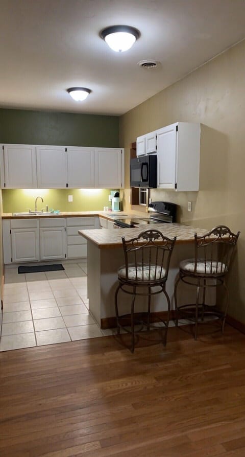 Kitchen with peninsula bar seating for two