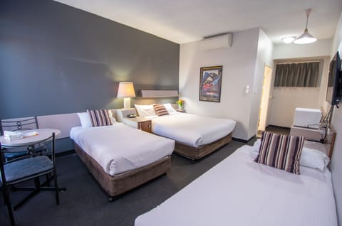 Family Room, 1 Bedroom | Blackout drapes, iron/ironing board, free WiFi, bed sheets