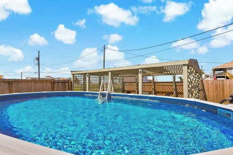 Pool Paradise: Dive into fun in this sparkling pool with sunny skies above! Perfect for relaxation.