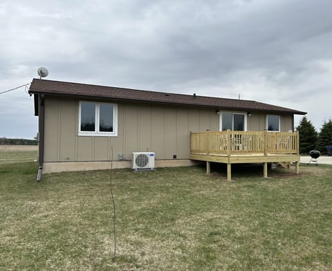 Back of the house with a new deck 