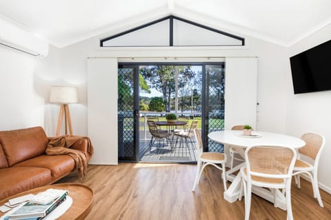 Deluxe Cabin - Sleeps 4 - Dog Friendly | Living area | 32-inch flat-screen TV with digital channels, TV