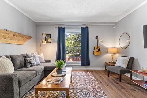 Bright and spacious living room off the kitchen. Smart TV, room darkening shades, and pull-out sleeper sofa for ultimate comfort + Dining table that can seat 4 people!