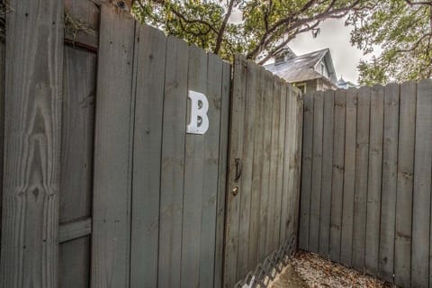 Wood fence with letter B marker