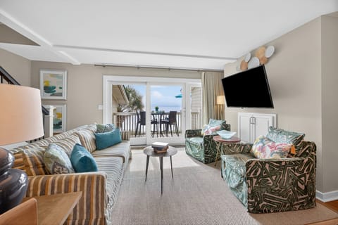 Imaging relaxing in this spacious living room with ocean views