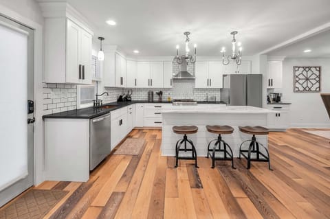 Beautiful new kitchen featuring modern appliances, sleek countertops, and plenty of space to cook and gather. Fully equipped with all the essentials for preparing and enjoying delicious meals together.