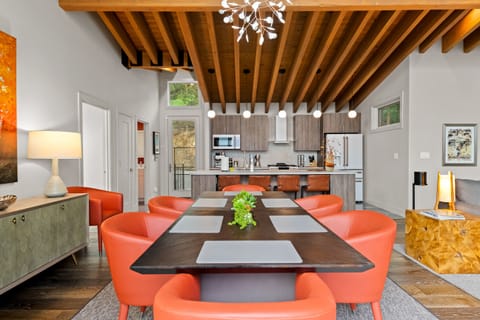 Dining room and kitchen with front door to the left of the kitchen