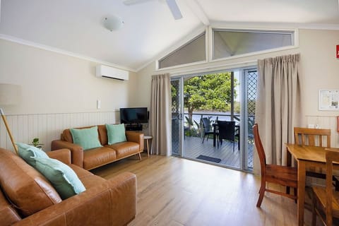 Superior Cabin - Sleeps 4 | Living area | 32-inch TV with digital channels