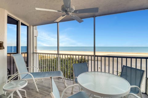 Sliding glass doors from the master bedroom open directly onto the screened balcony.