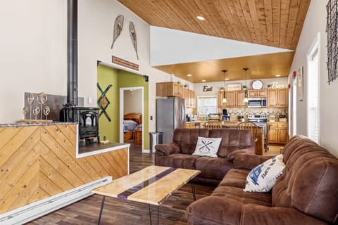 Living Room as you walk-in.  New Couches and PA Live Edge Wood Coffee Table.  