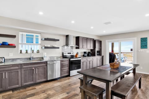 Seating for 10 at the dining table with additional seating at the bar height table