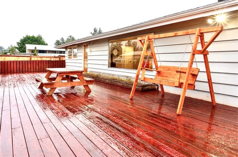 Entertaining deck with swing and picnic table