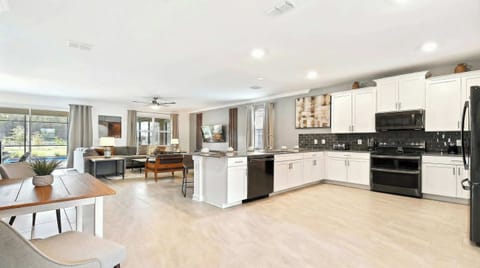 The expansive chef's kitchen is fully equipped with all the amenities and tools you could possibly need.