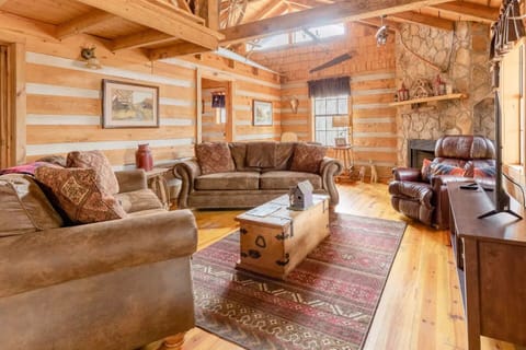 Your den is an authentic log cabin that is warm and cozy