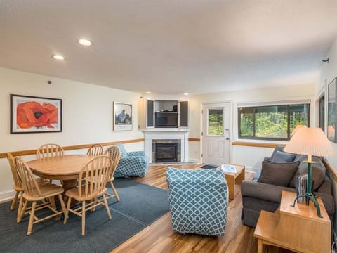 Open floor plan with living and dining area plus lovely gas fireplace