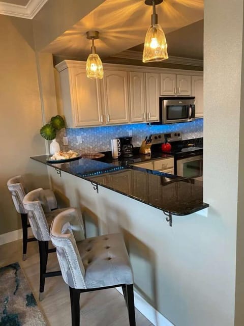 Kitchen Bar Top with Hand Blown Glass Pendants.