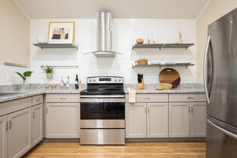 Spacious kitchen features modern appliances.