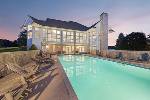 Luxuriate in a night time swim in the pool`s glowing emerald water