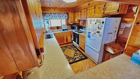 Kitchen has double sink, Keurig, coffee maker, toaster, other small appliances