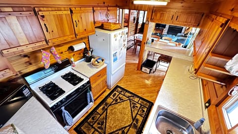 Full size range/oven + counter space! and fully stocked with kitchenware