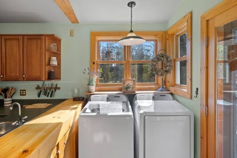 Washer & Dryer conveniently located in the kitchen.