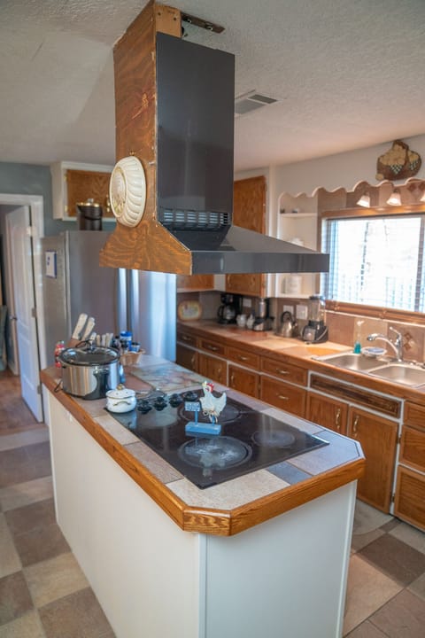 The Heart of the House w/built-in stovetop & oven, 3-door stainless fridge. 