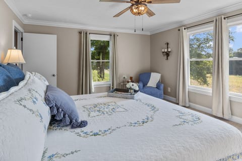 California King size bed master with reading area.