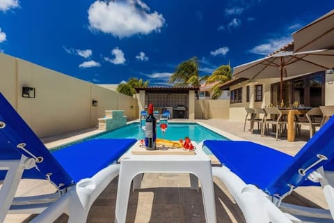 Relax Next to the Pool with a Wine or Champagne.

Large pool with Lounge chairs.