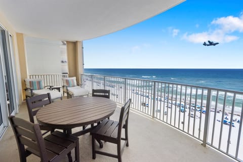 Savor morning coffee and ocean breezes on your private balcony, with direct beach views stretching to the horizon.