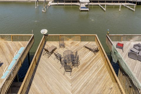 Your private waterfront deck offers stunning lake views with dining space and lounge chairs for the perfect lakeside getaway.