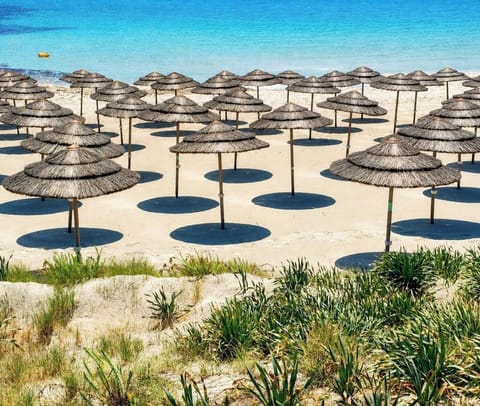 Beach nearby, white sand, sun loungers, beach umbrellas