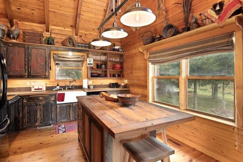 Here, you'll also find our huge island with barstools and a direct line of sight into the den.