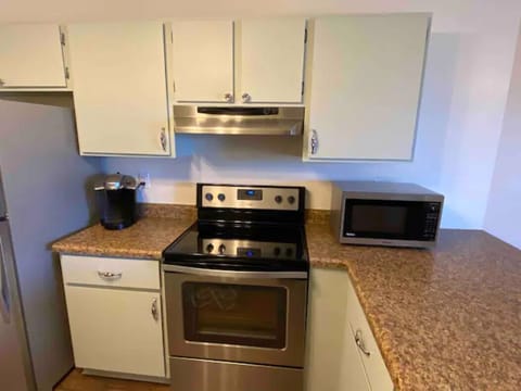 Oven, stove, dishwasher, refrigerator, microwave, and Keurig.