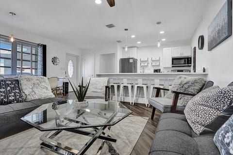 This is the living room. The space is cozy. It is also comfortable. 