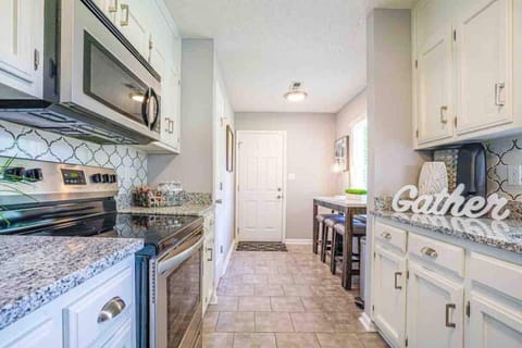 Kitchen. Beautiful back splash, stainless steel hardware, granite counter tops. 