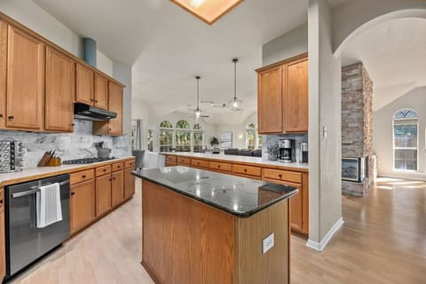 Spacious chef’s kitchen with granite island—perfect for family meals, remote work, or relaxing after a day near Apple’s North Austin campus.