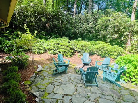 Outdoor fire pit with beautiful rhododendrons