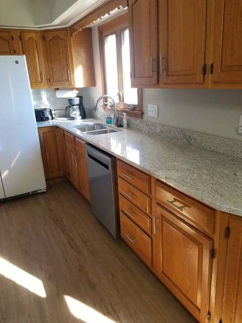 Fully stocked kitchen. Electric stove, full size refrigerator w/ice maker.