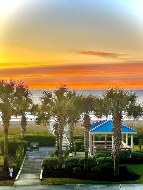 Beach walkway view from the resort’s shared second-floor balcony