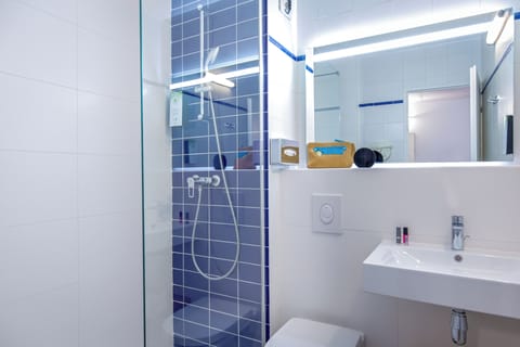 Shower, eco-friendly toiletries, hair dryer, towels