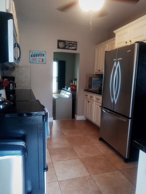 The kitchen leads you right into the laundry room.