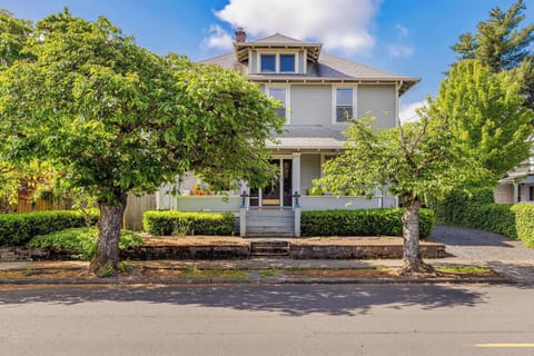 Charming historic home with spacious porch, mature trees, walkable location, and cozy comfort for your perfect getaway.