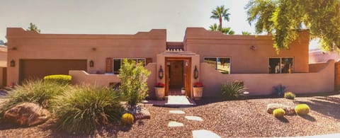 Sophisticated Santa Fe ranch on a quiet cul-de-sac. Backs up to greenbelt.