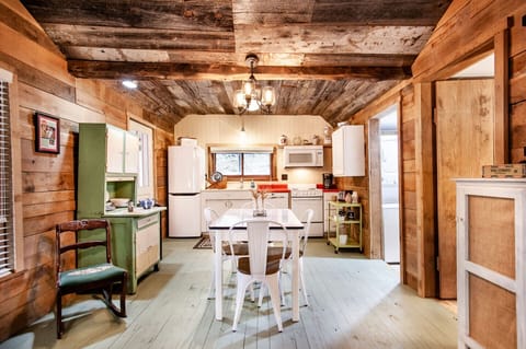 The spacious dining area is perfect for gatherings, with vintage-inspired touches that make every meal feel special.