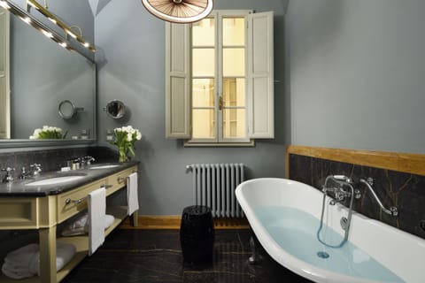 Suite, Garden View | Bathroom | Deep soaking tub, rainfall showerhead, designer toiletries, hair dryer