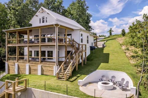 Enjoy lake views from 2 porches or from the firepit