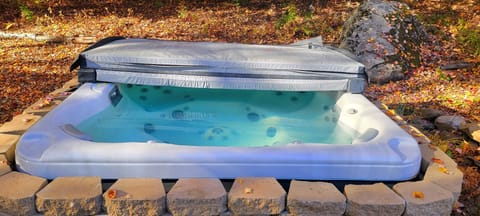 Private hot tub area seats six comfortably.