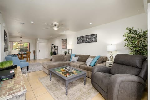 Living room has a sofa bed couch and power recliner.